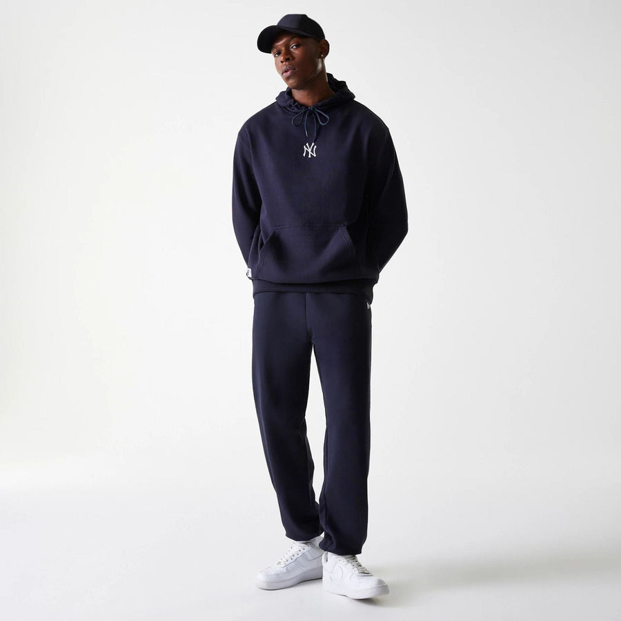 The Male model is wearing New York Yankees MLB League Essential Midi Navy Joggers 8