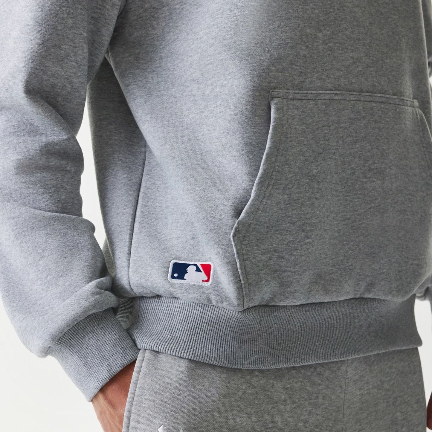 The Male model is wearing New York Yankees MLB League Essential Grey Oversized Pullover Hoodie 5