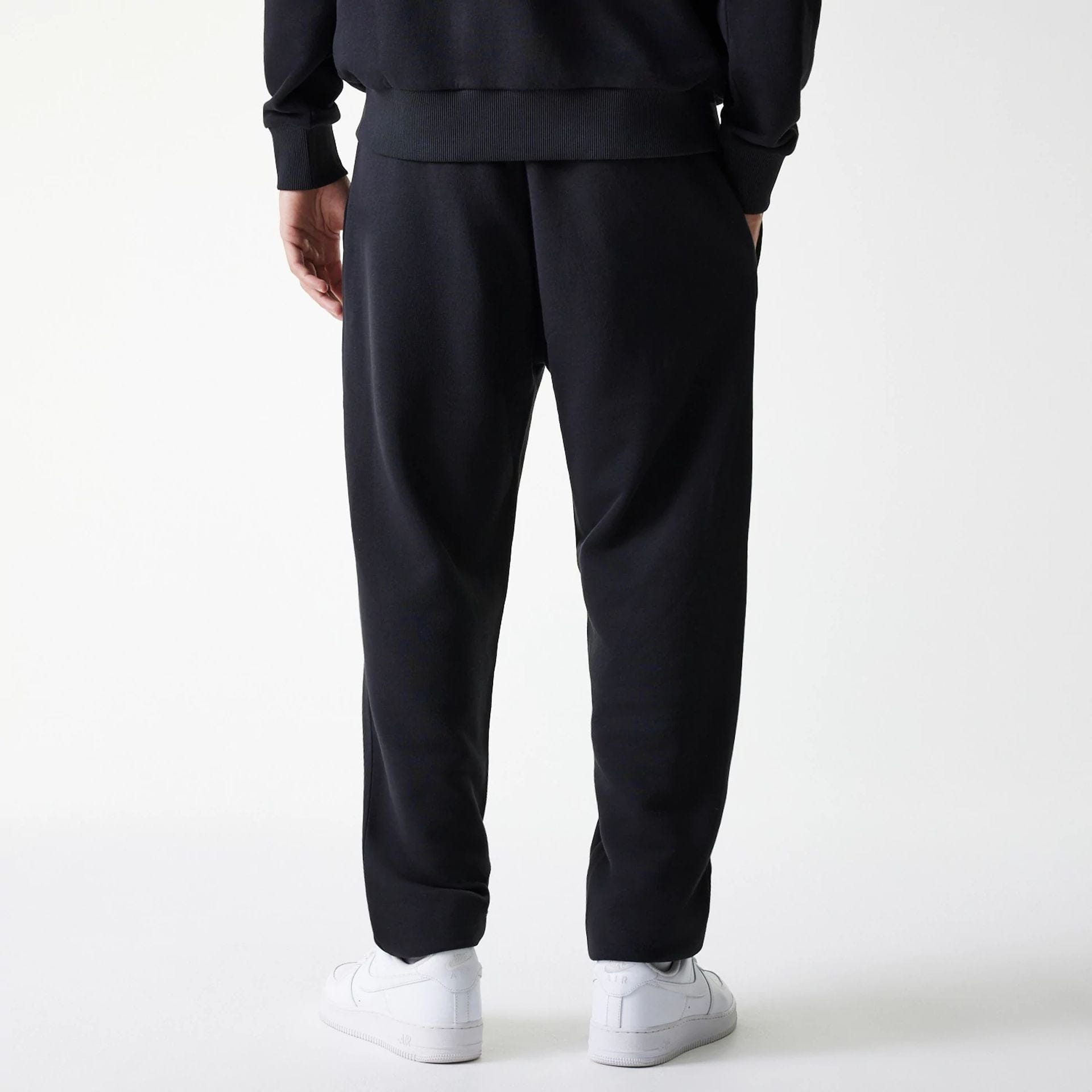 The Male model is wearing New York Yankees MLB League Essential Black Joggers 2