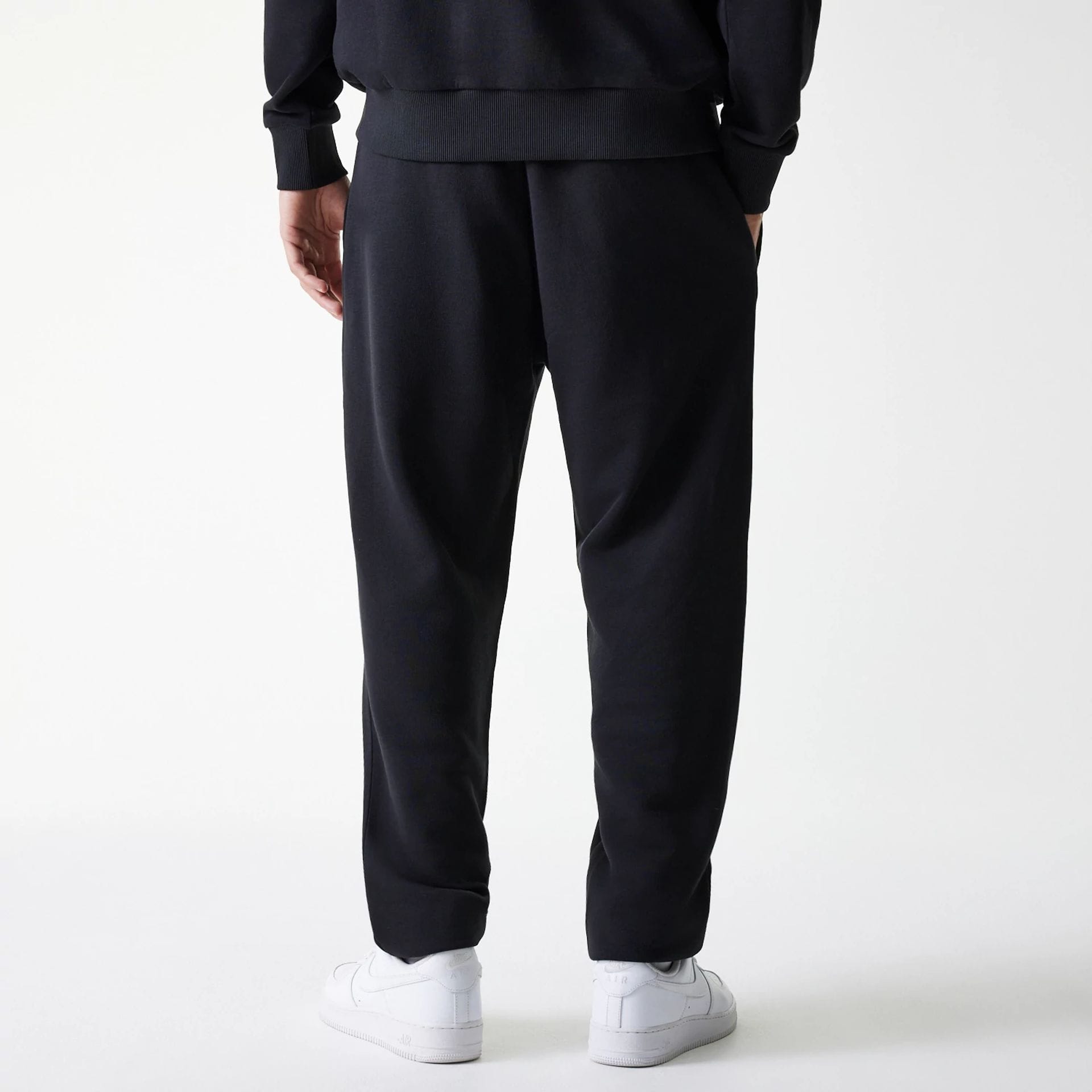 The Male model is wearing New York Yankees MLB League Essential Black Joggers 2