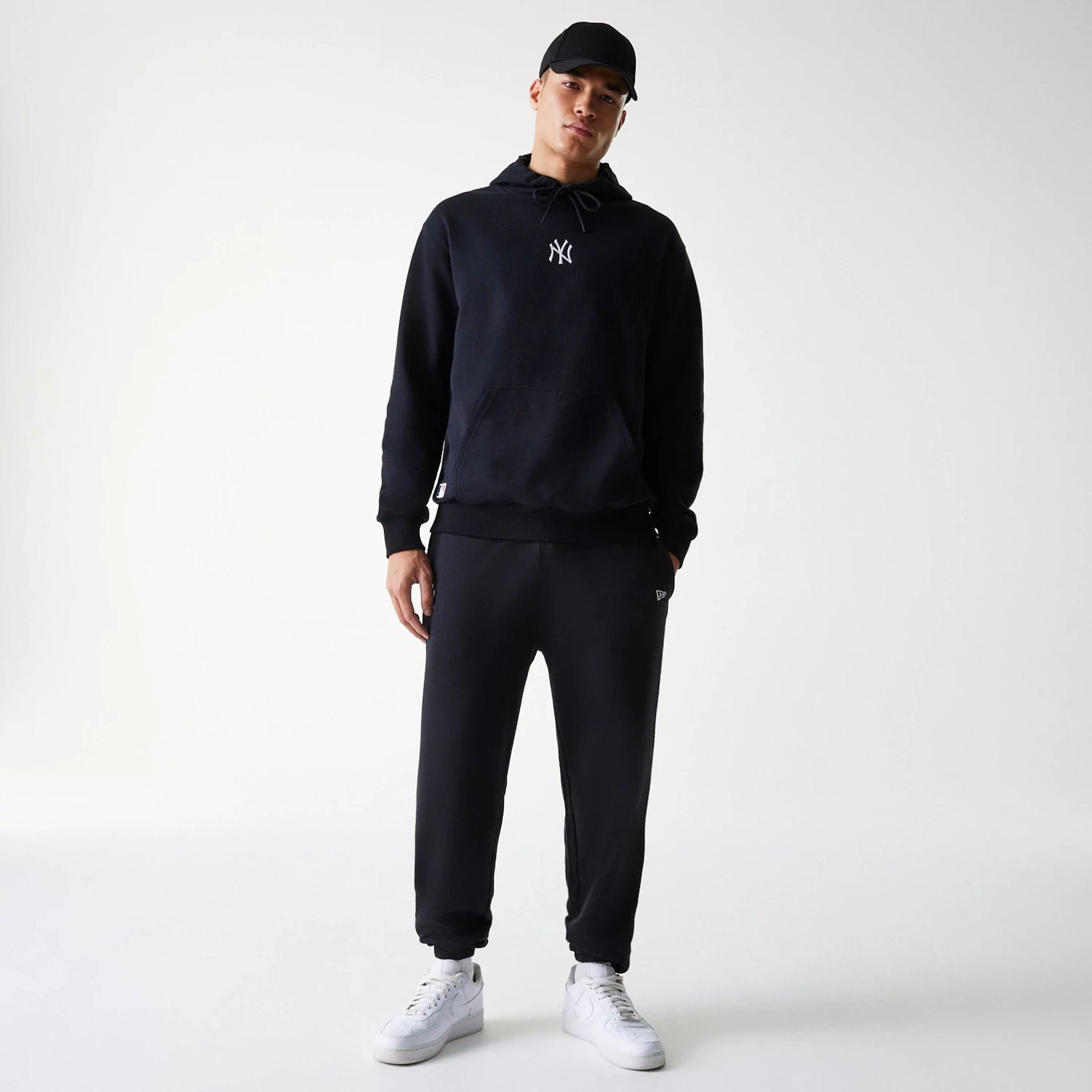 The Male model is wearing New York Yankees MLB League Essential Black Joggers 8
