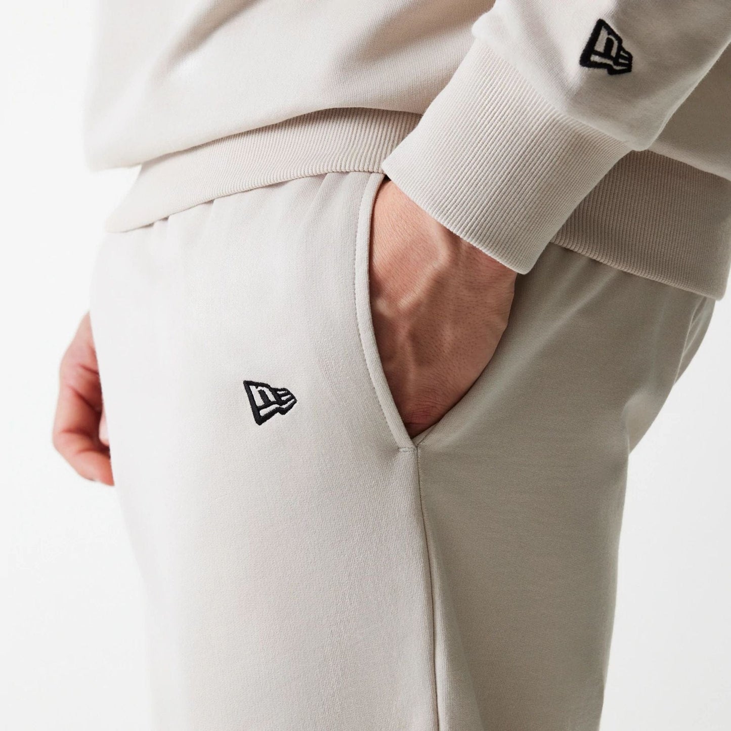 The Male model is wearing New York Yankees MLB League Essential Midi Cream Joggers 5