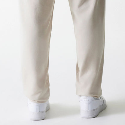 The Male model is wearing New York Yankees MLB League Essential Midi Cream Joggers 7