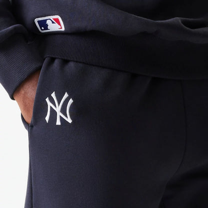 The Male model is wearing New York Yankees MLB League Essential Navy Joggers 4