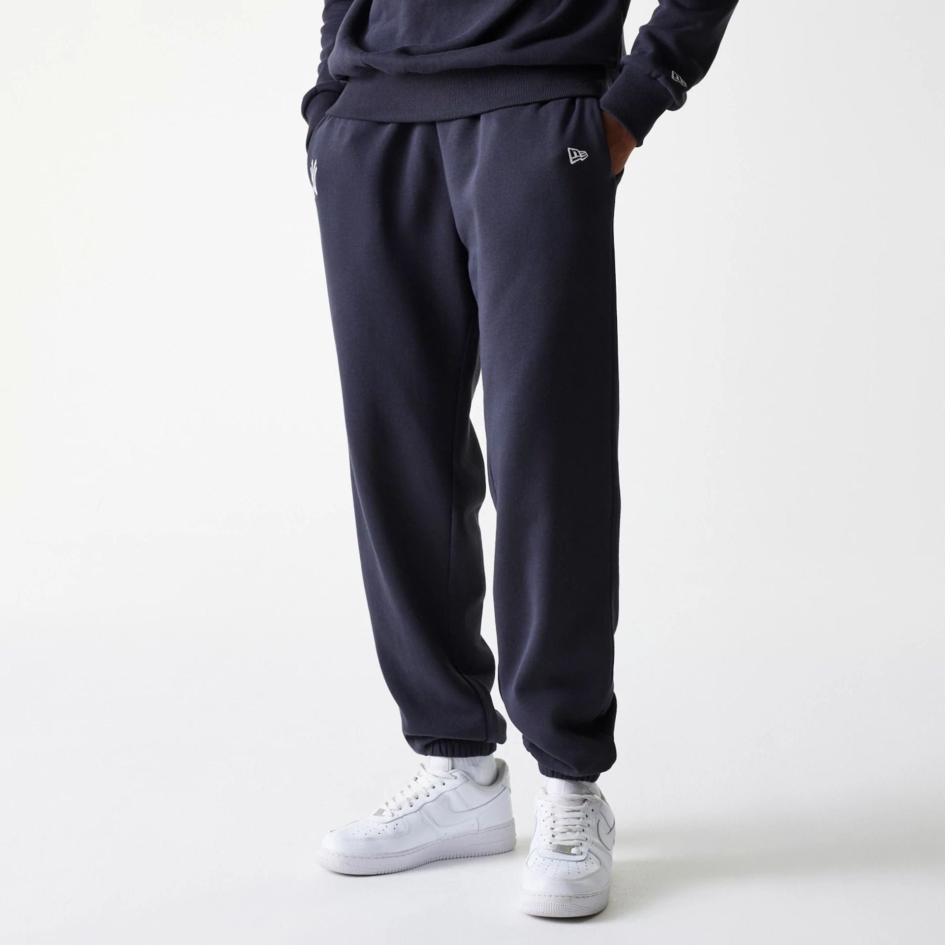 The Male model is wearing New York Yankees MLB League Essential Navy Joggers 3