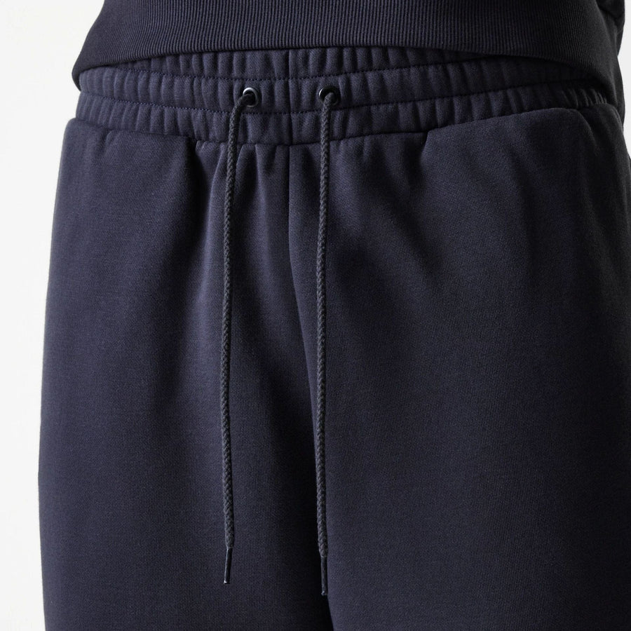 The Male model is wearing New York Yankees MLB League Essential Navy Joggers 6