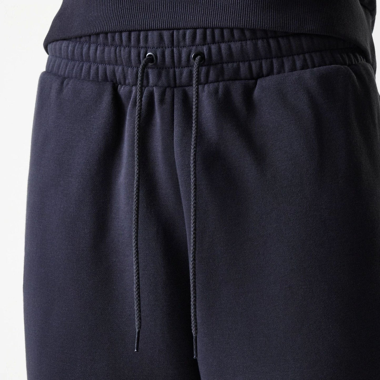 The Male model is wearing New York Yankees MLB League Essential Navy Joggers 6