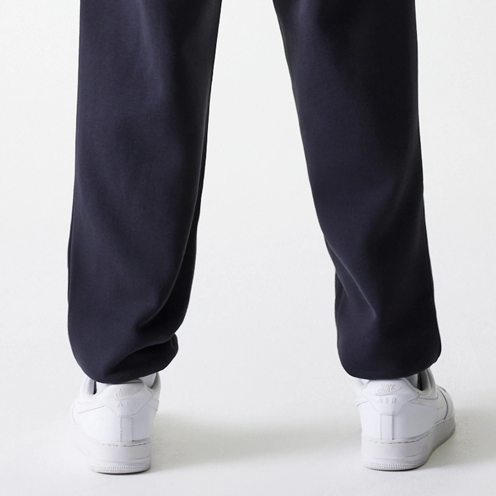 The Male model is wearing New York Yankees MLB League Essential Navy Joggers 7