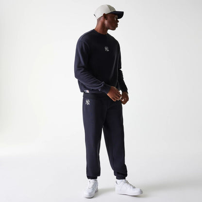 The Male model is wearing New York Yankees MLB League Essential Navy Joggers 8