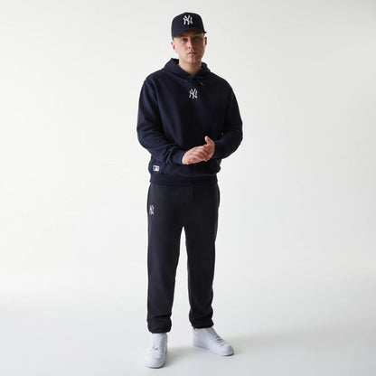 The Male model is wearing New York Yankees MLB League Essential Navy Oversized Pullover Hoodie 8