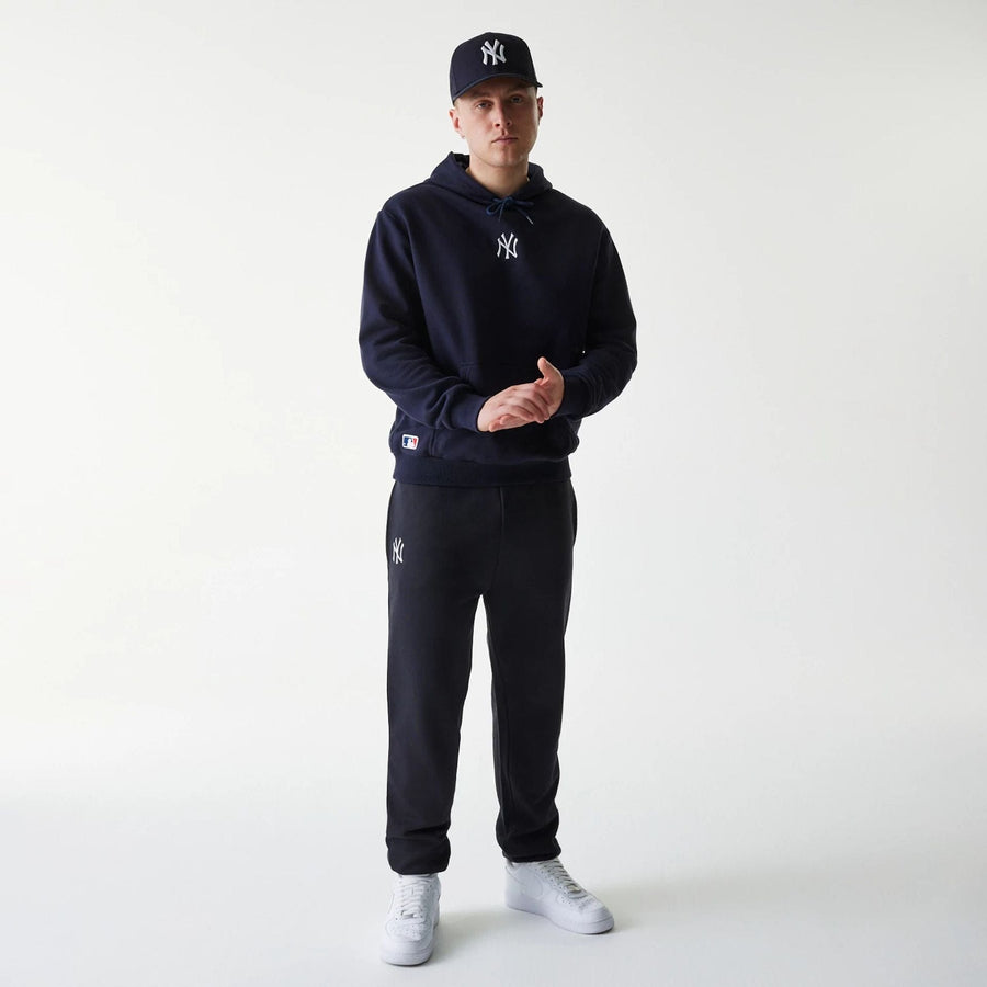 The Male model is wearing New York Yankees MLB League Essential Navy Oversized Pullover Hoodie 8