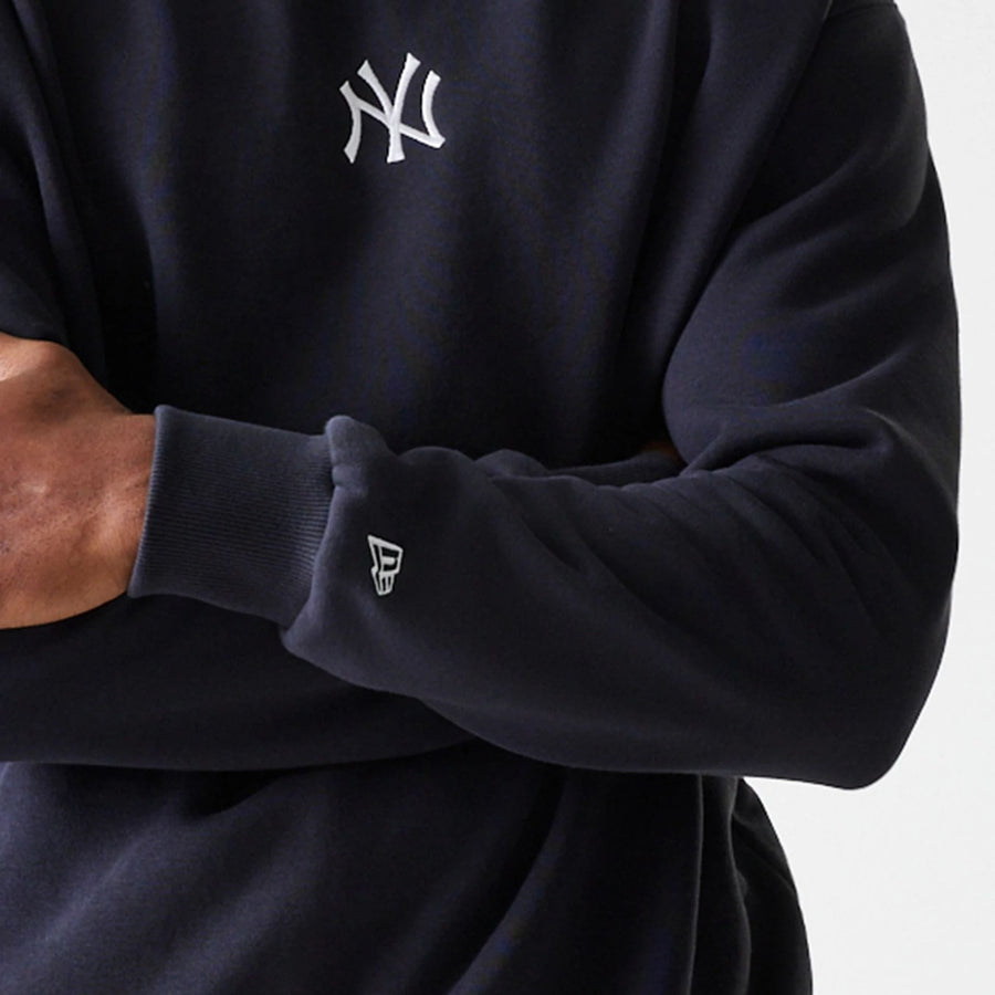 The Male model is wearing New York Yankees MLB League Essential Midi Navy Oversized Crew Neck Sweater 5