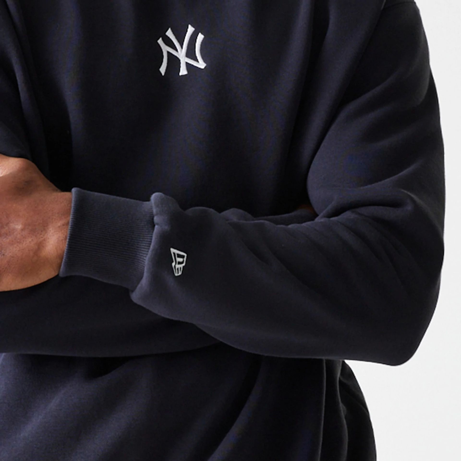 The Male model is wearing New York Yankees MLB League Essential Midi Navy Oversized Crew Neck Sweater 5