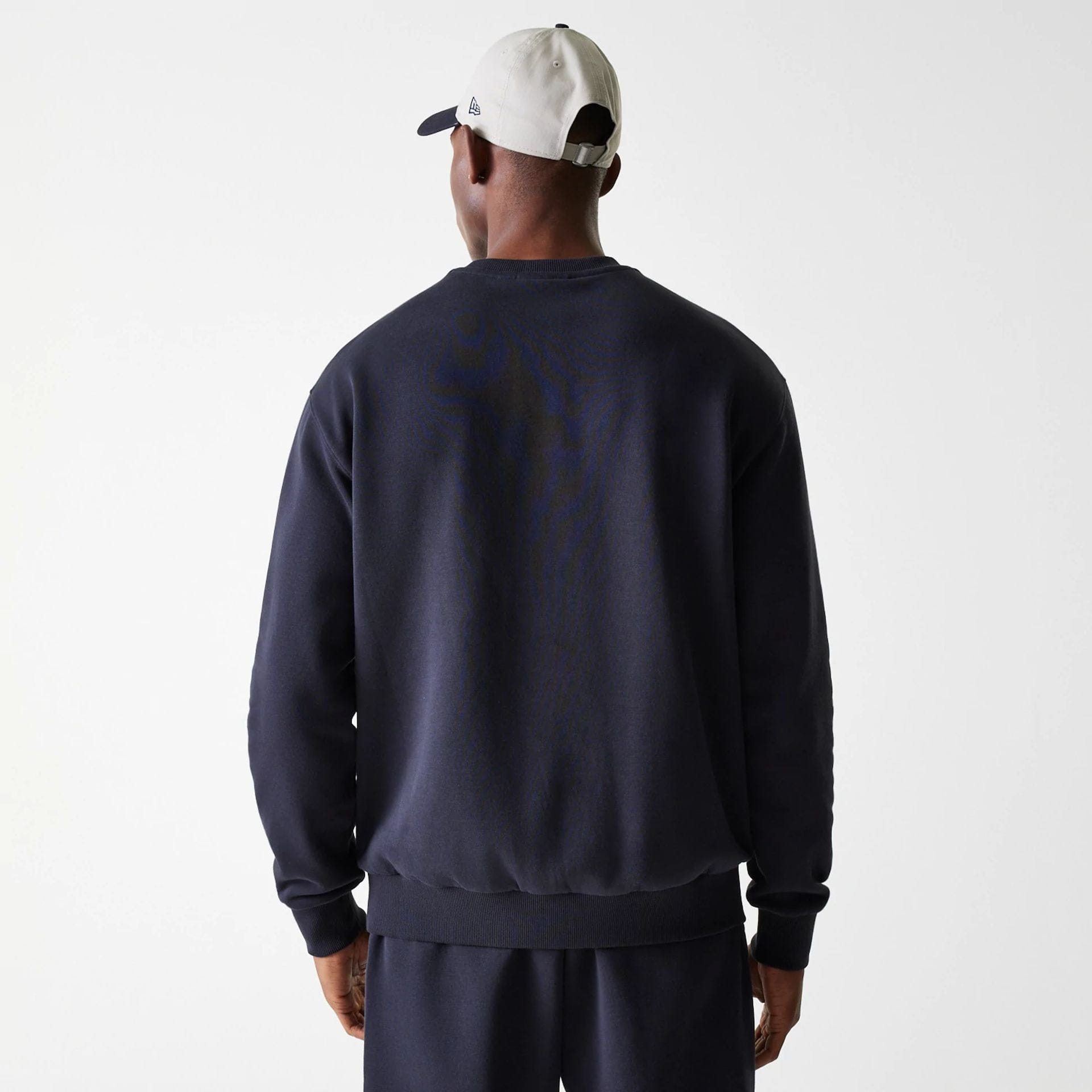 The Male model is wearing New York Yankees MLB League Essential Midi Navy Oversized Crew Neck Sweater 2