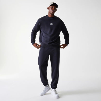 The Male model is wearing New York Yankees MLB League Essential Midi Navy Oversized Crew Neck Sweater 7