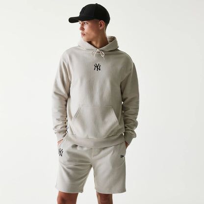 The Male model is wearing New York Yankees MLB League Essential Cream Oversized Pullover Hoodie 1