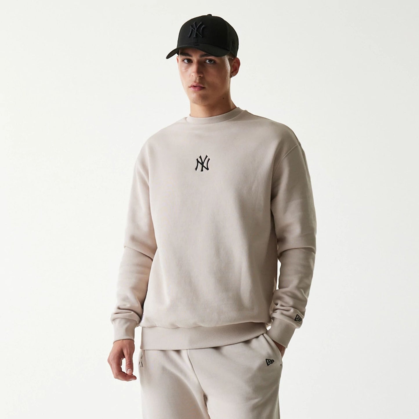 The Male model is wearing New York Yankees MLB League Essential Midi Cream Oversized Crew Neck Sweater 3