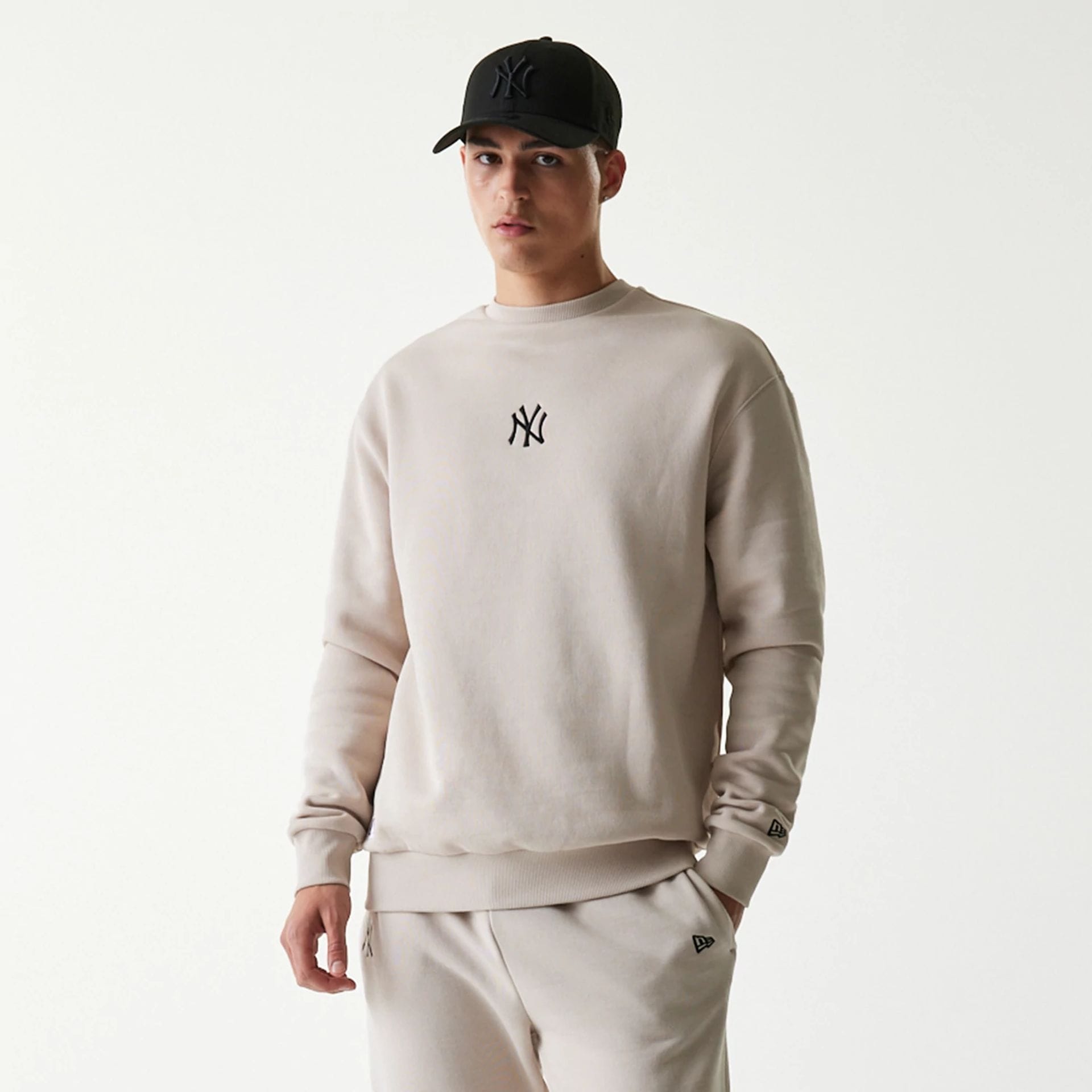 The Male model is wearing New York Yankees MLB League Essential Midi Cream Oversized Crew Neck Sweater 3
