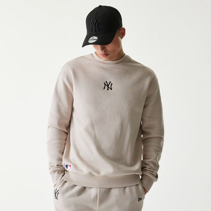 The Male model is wearing New York Yankees MLB League Essential Midi Cream Oversized Crew Neck Sweater 1