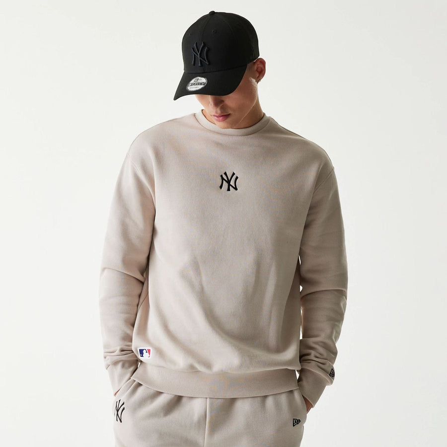 The Male model is wearing New York Yankees MLB League Essential Midi Cream Oversized Crew Neck Sweater 1