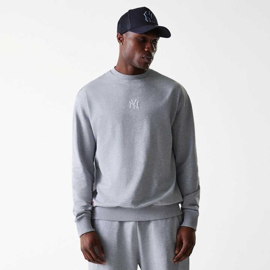 The Male model is wearing New York Yankees MLB League Essential Midi Grey Oversized Crew Neck Sweater 1