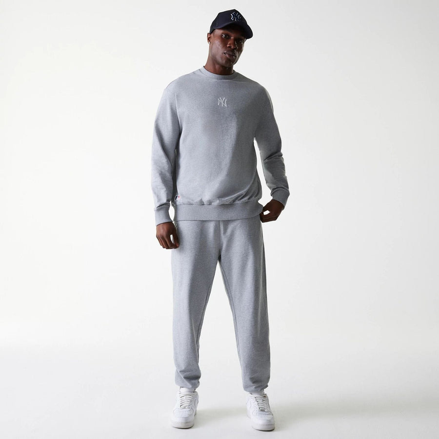 The Male model is wearing New York Yankees MLB League Essential Midi Grey Oversized Crew Neck Sweater 7