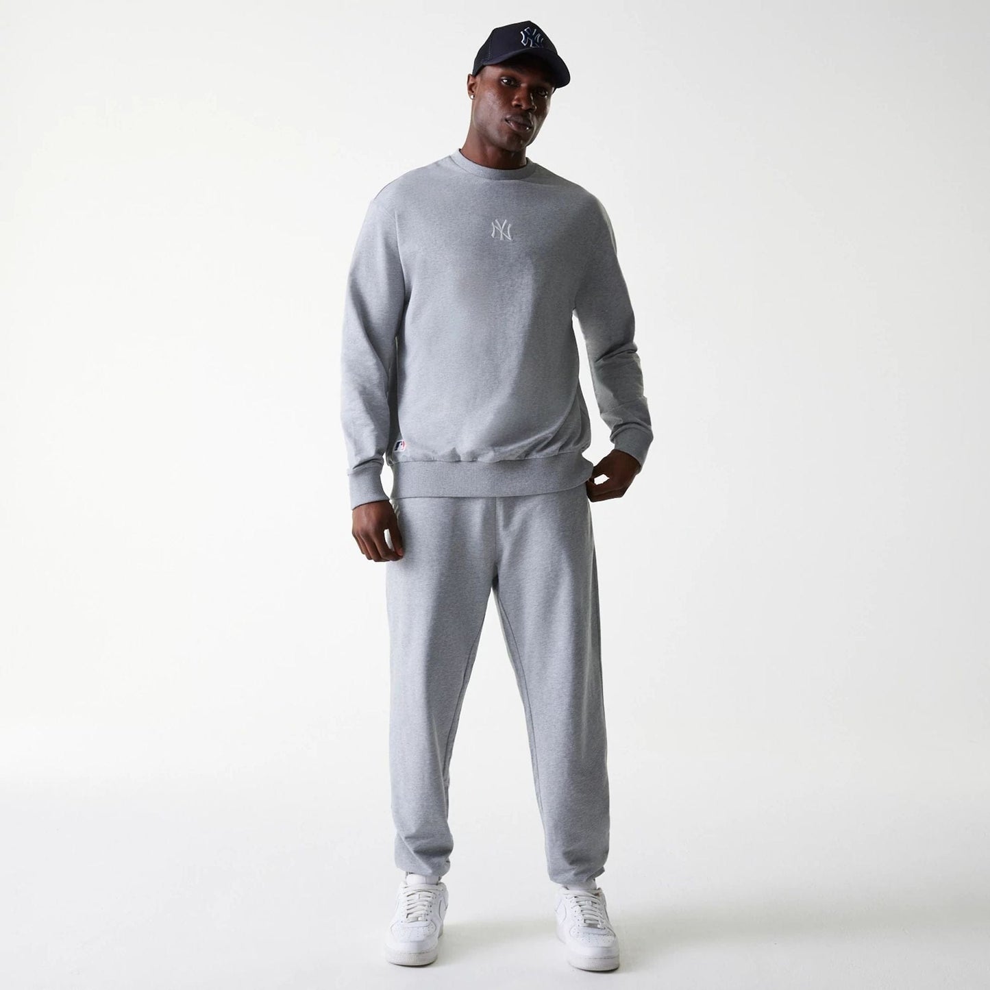 The Male model is wearing New York Yankees MLB League Essential Midi Grey Oversized Crew Neck Sweater 7