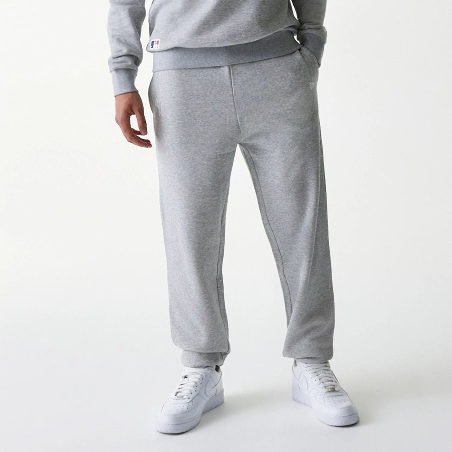 The Male model is wearing New York Yankees MLB League Essential Grey Joggers 6