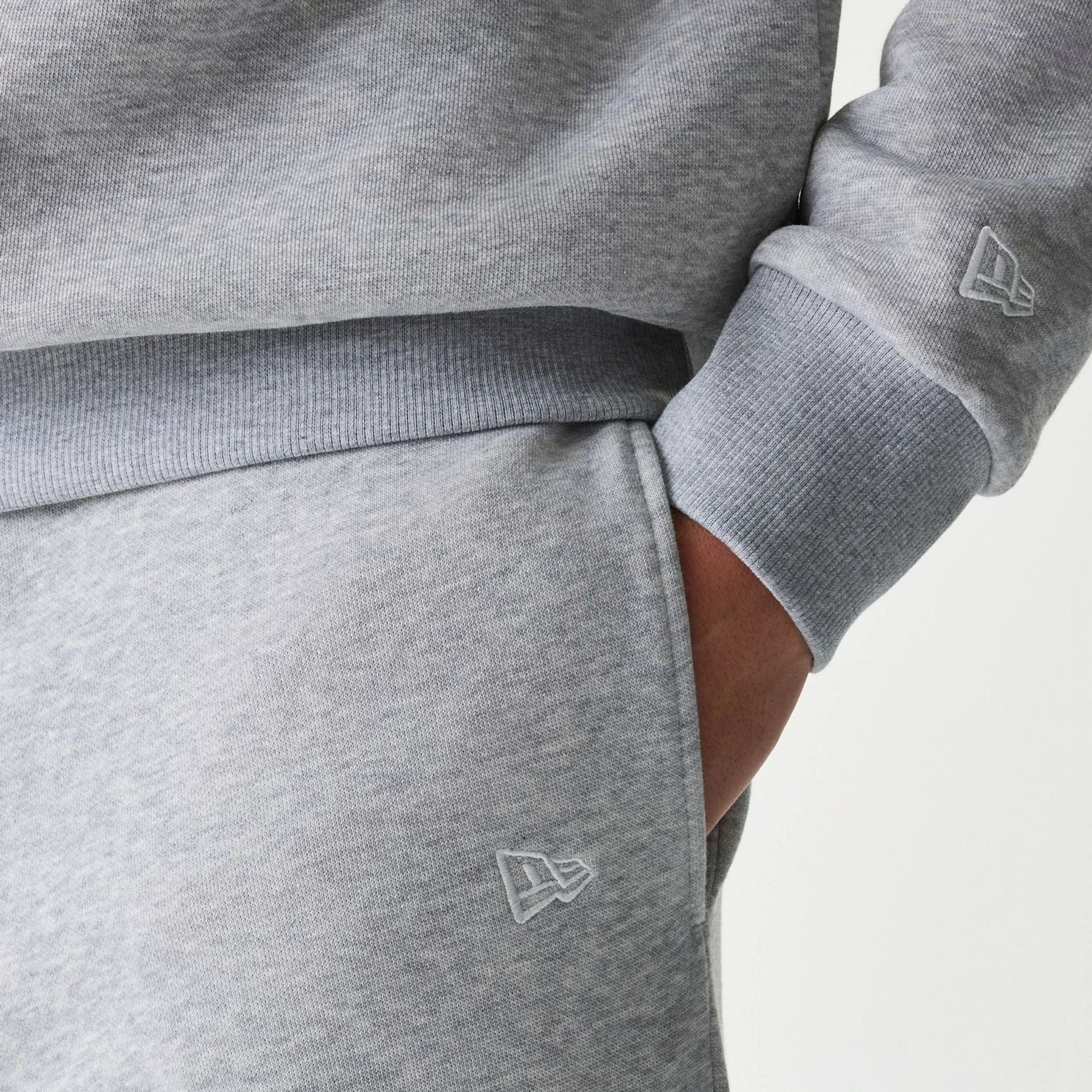 The Male model is wearing New York Yankees MLB League Essential Grey Joggers 4