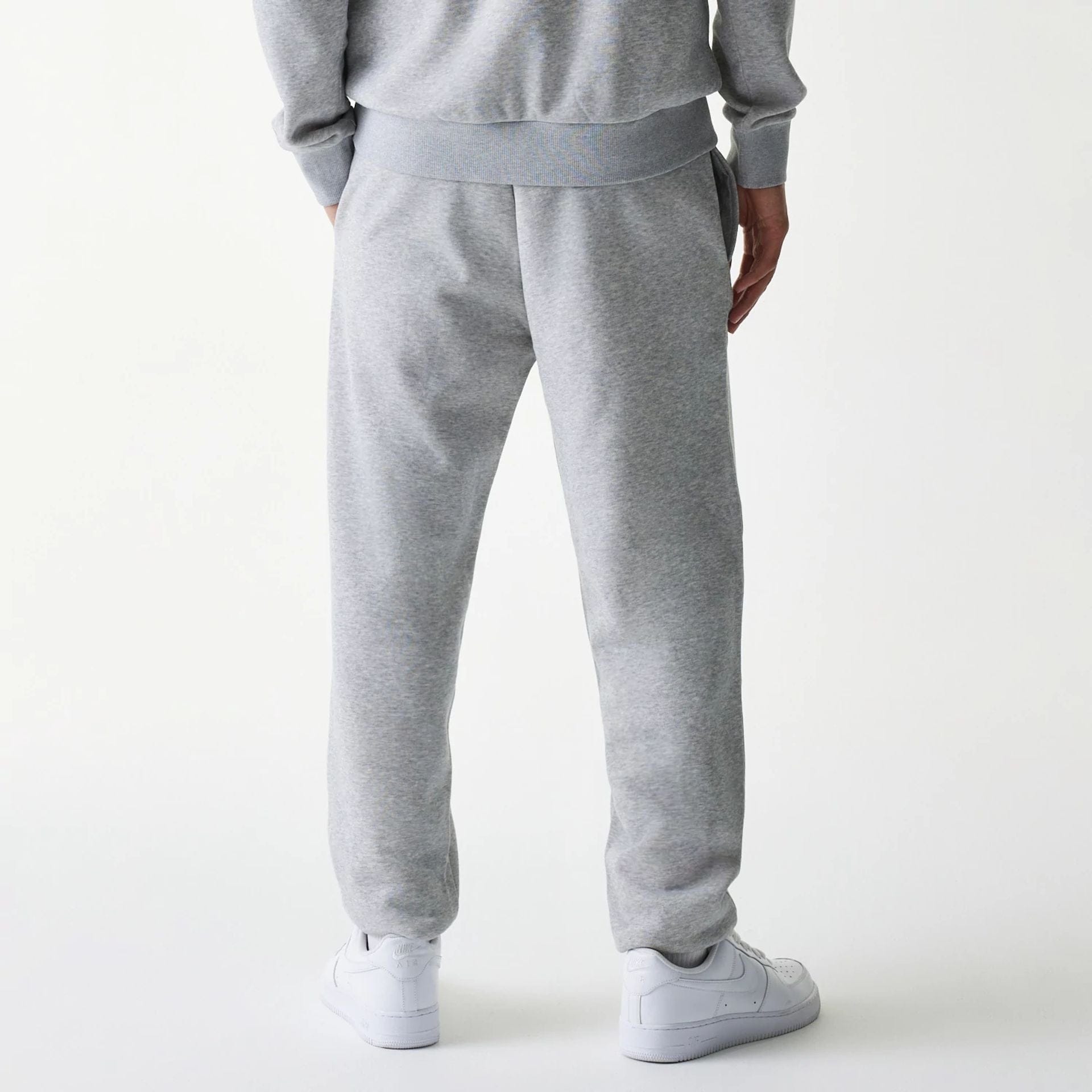 The Male model is wearing New York Yankees MLB League Essential Grey Joggers 2