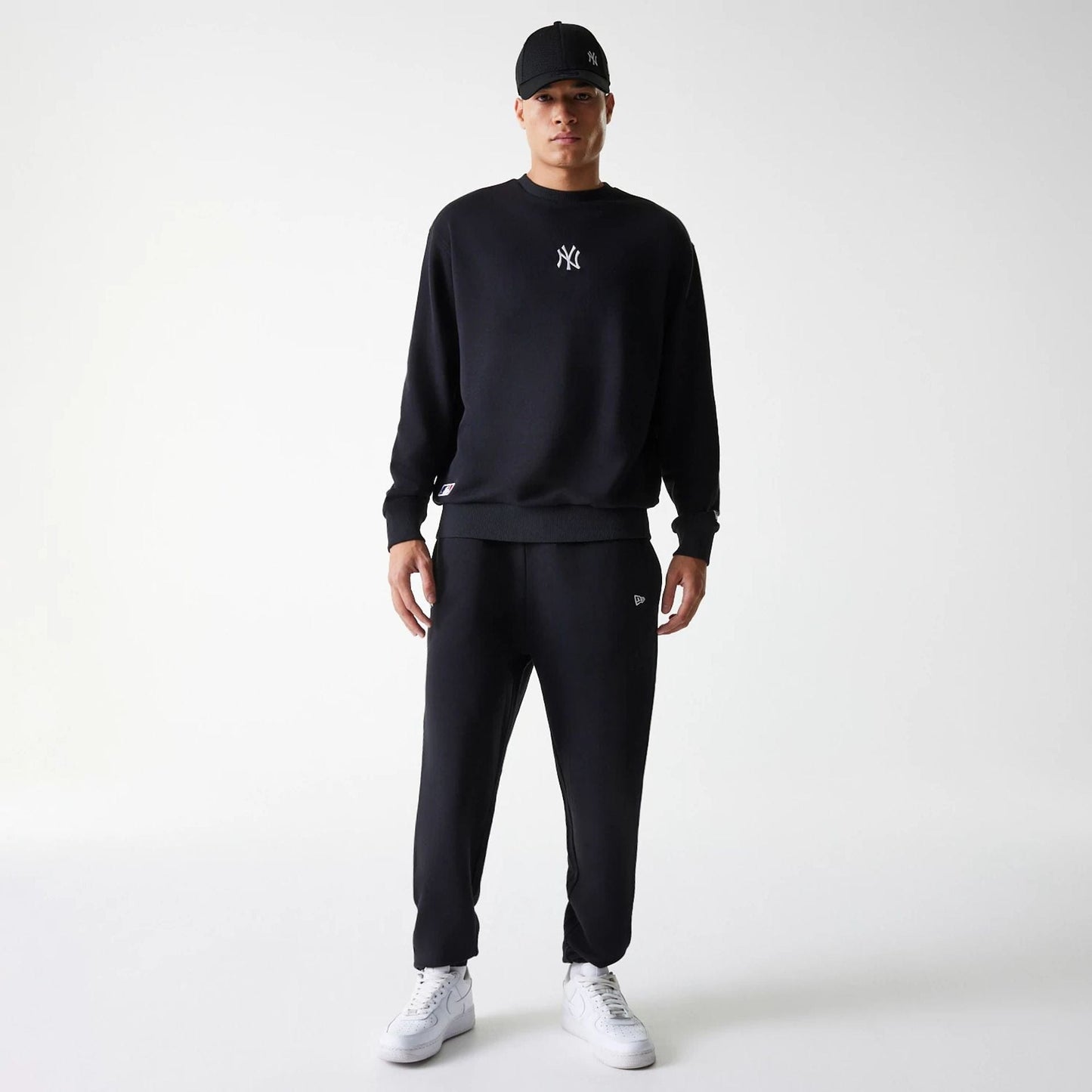 The Male model is wearing New York Yankees MLB League Essential Midi Black Oversized Crew Neck Sweater 7