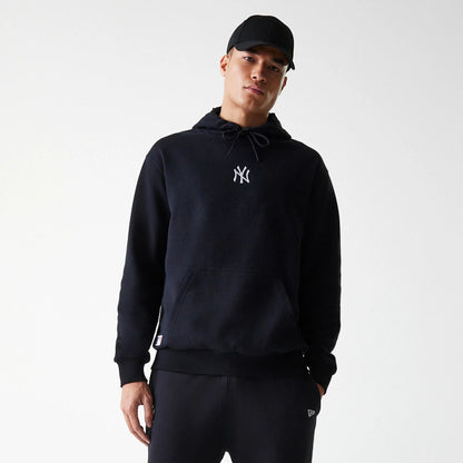 The Male model is wearing New York Yankees MLB League Essential Black Oversized Pullover Hoodie 3