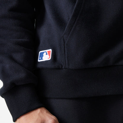 The Male model is wearing New York Yankees MLB League Essential Black Oversized Pullover Hoodie 5