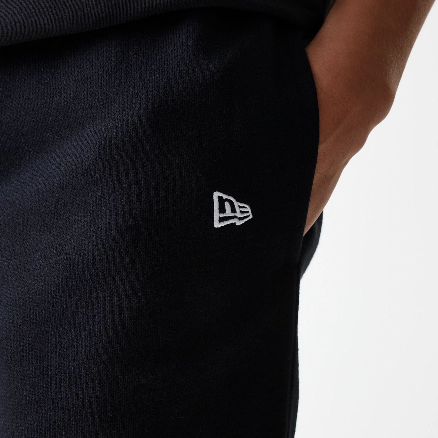 The Male model is wearing New York Yankees MLB League Essential Midi Black Shorts 5