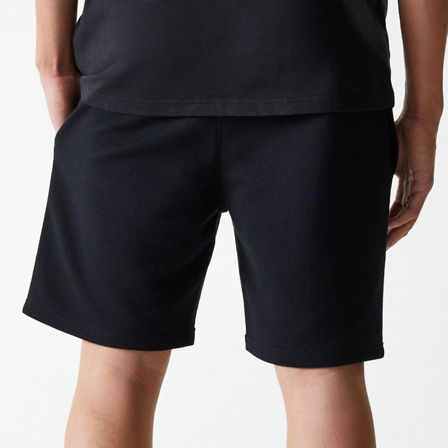 The Male model is wearing New York Yankees MLB League Essential Midi Black Shorts 7