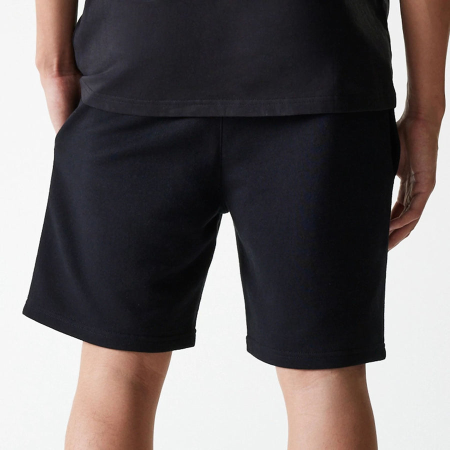 The Male model is wearing New York Yankees MLB League Essential Midi Black Shorts 7
