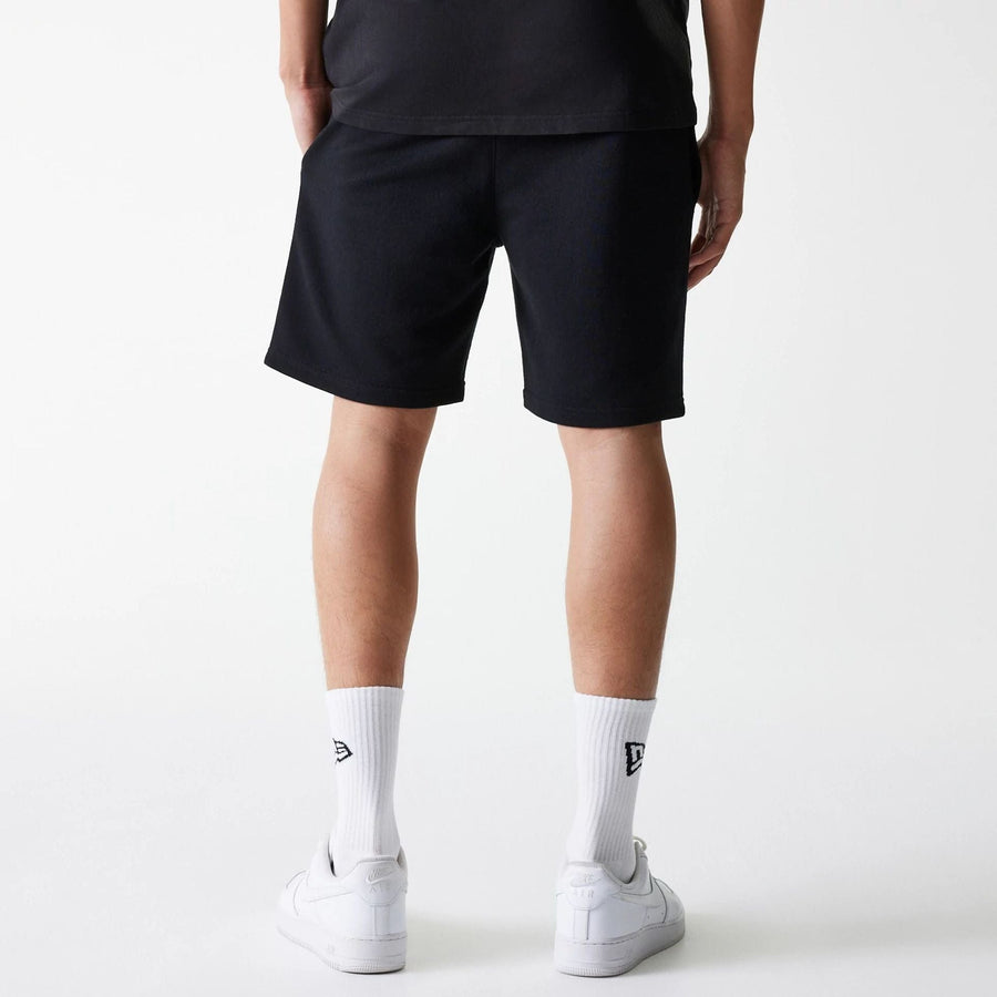 The Male model is wearing New York Yankees MLB League Essential Midi Black Shorts 2