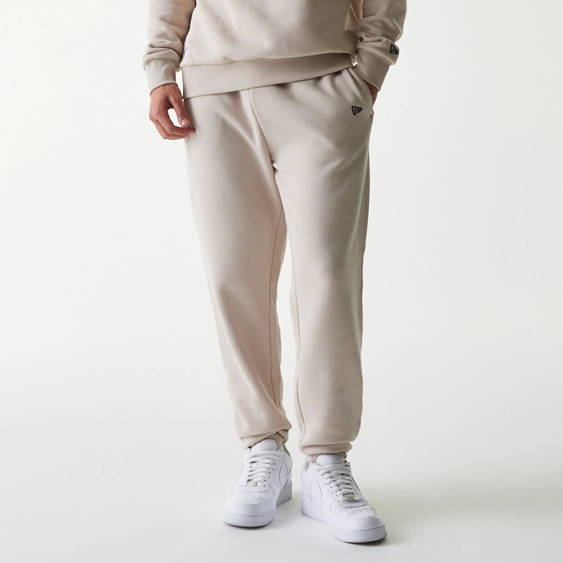 The Male model is wearing New York Yankees MLB League Essential Cream Joggers 4
