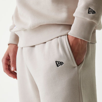 The Male model is wearing New York Yankees MLB League Essential Cream Joggers 5