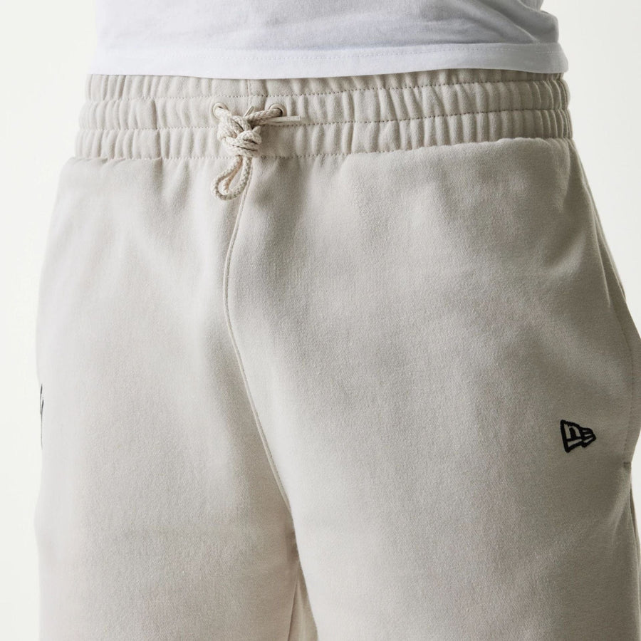 The Male model is wearing New York Yankees MLB League Essential Midi Cream Shorts 3