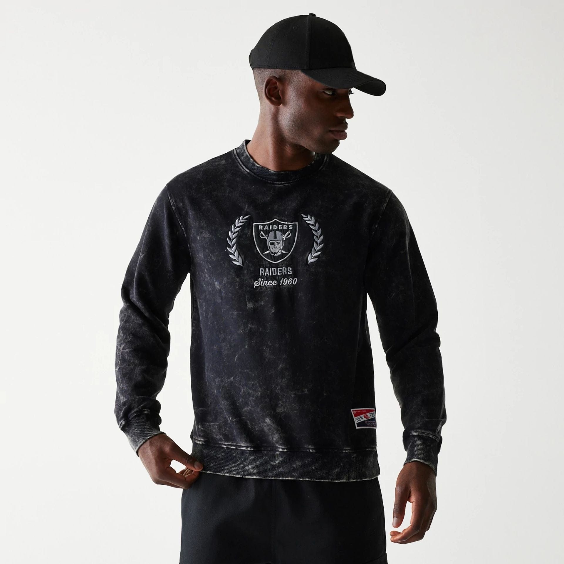 The Male model is wearing Las Vegas Raiders NFL Throwback Black Crew Neck Sweater 1