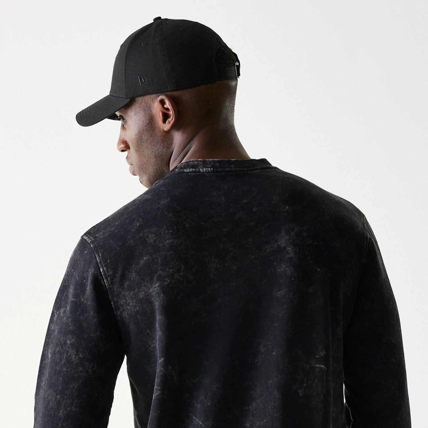 The Male model is wearing Las Vegas Raiders NFL Throwback Black Crew Neck Sweater 5