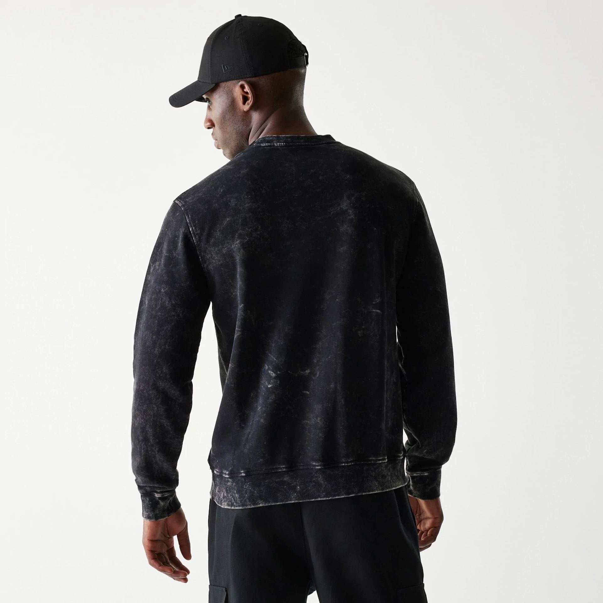 The Male model is wearing Las Vegas Raiders NFL Throwback Black Crew Neck Sweater 2