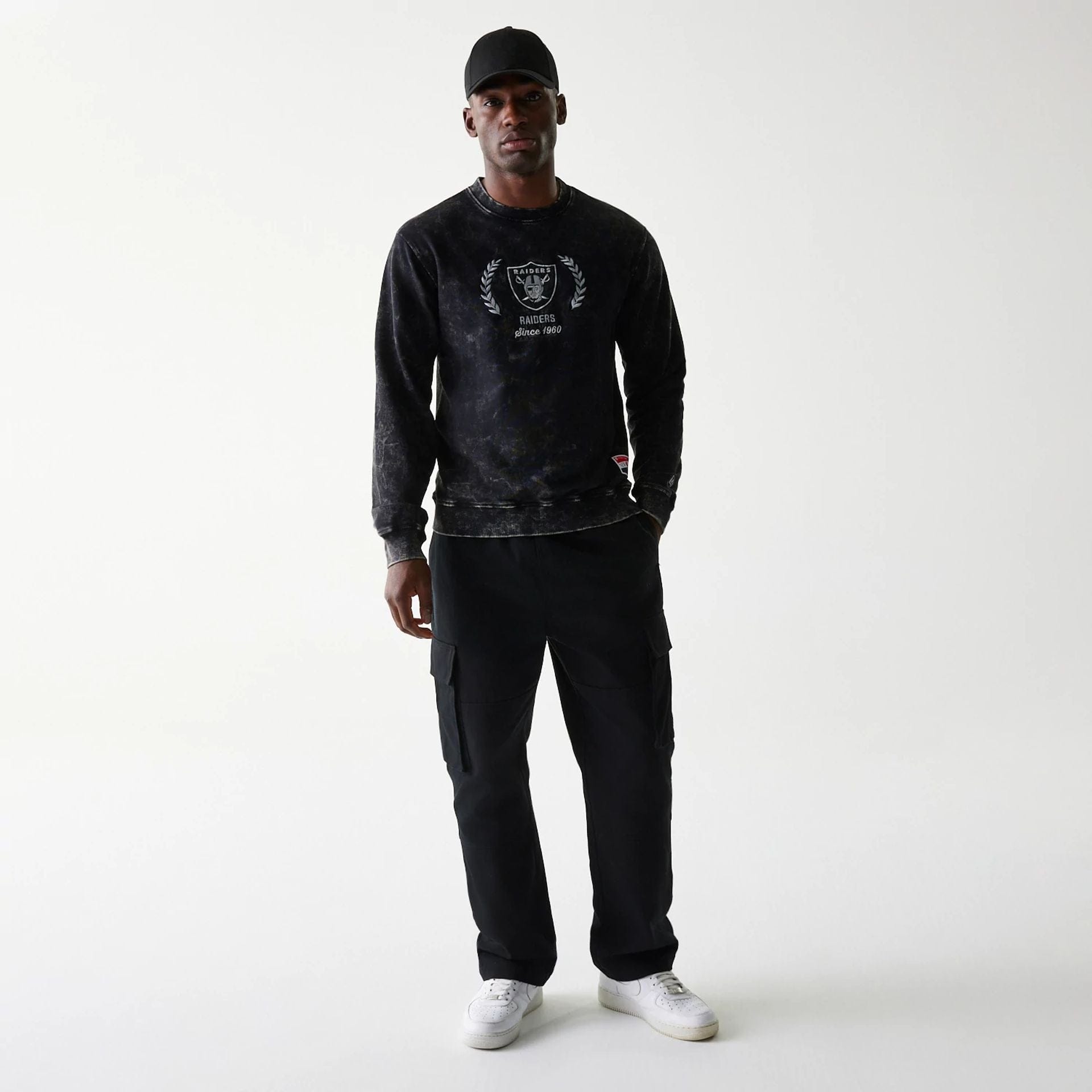 The Male model is wearing Las Vegas Raiders NFL Throwback Black Crew Neck Sweater 6