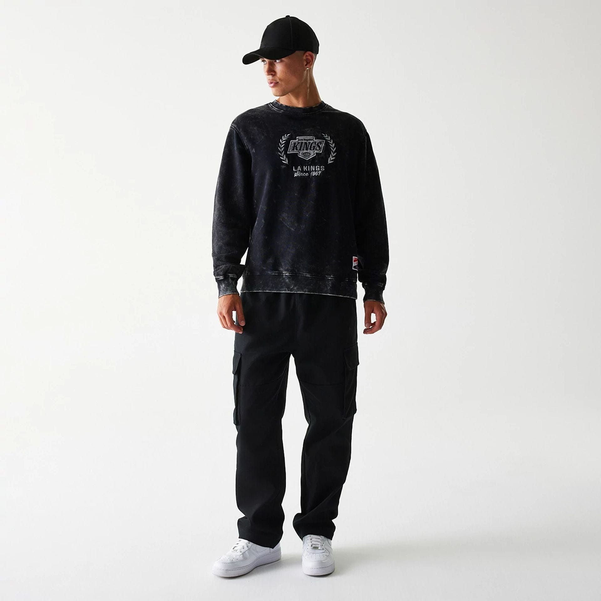 The Male model is wearing LA Kings NHL Throwback Black Crew Neck Sweater 6