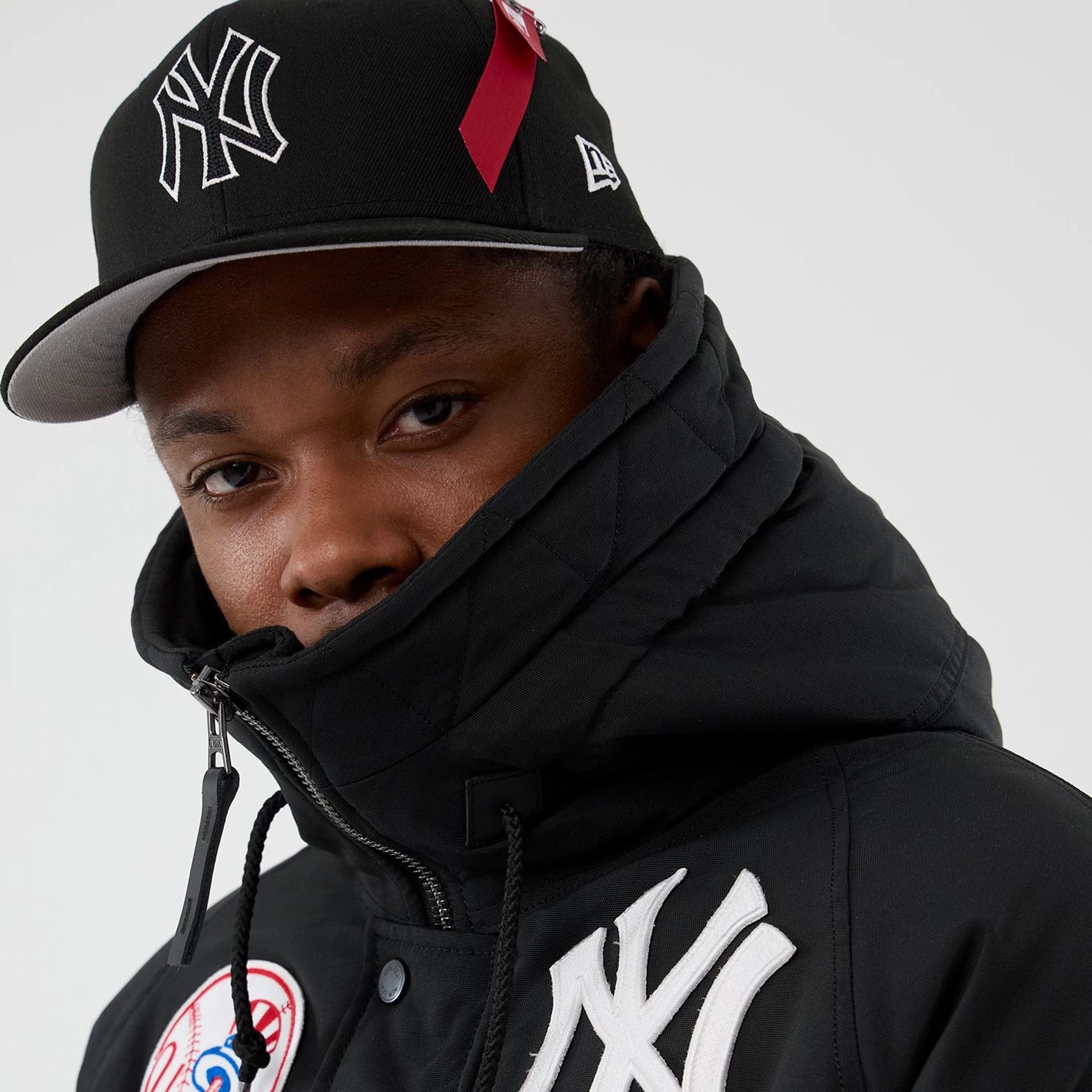 The Male model is wearing New York Yankees MLB X Alpha Black Parka Jacket 6