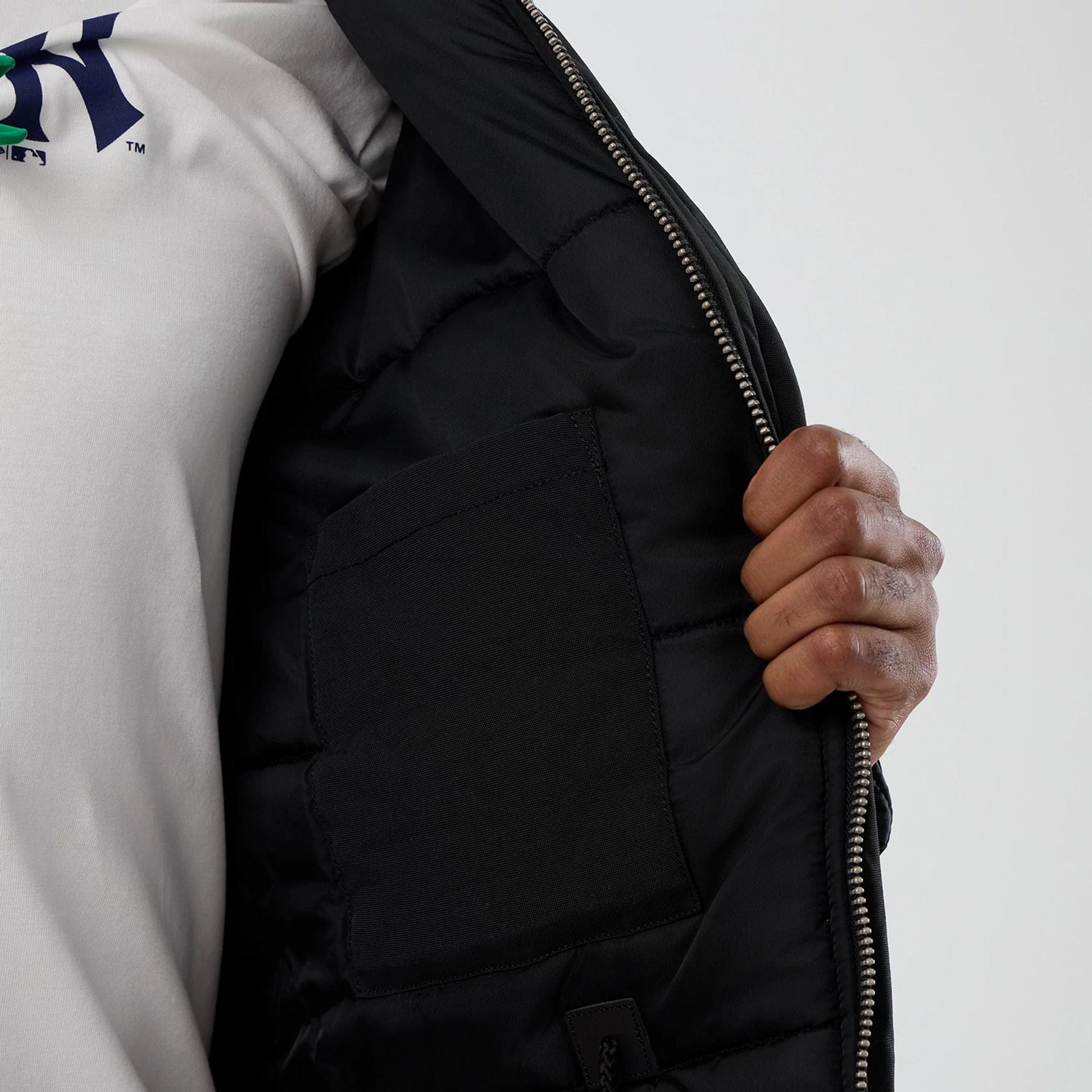 The Male model is wearing New York Yankees MLB X Alpha Black Parka Jacket 7