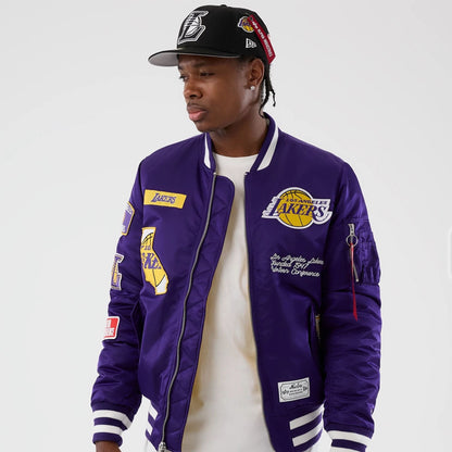 The Male model is wearing LA Lakers NBA x Alpha Purple Jacket 7