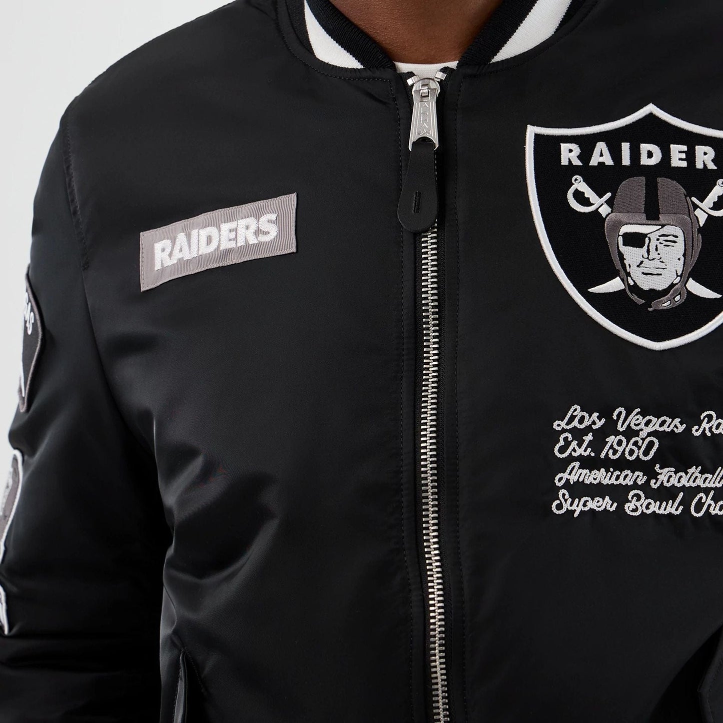 The Male model is wearing Las Vegas Raiders NFL x Alpha Black Jacket 4