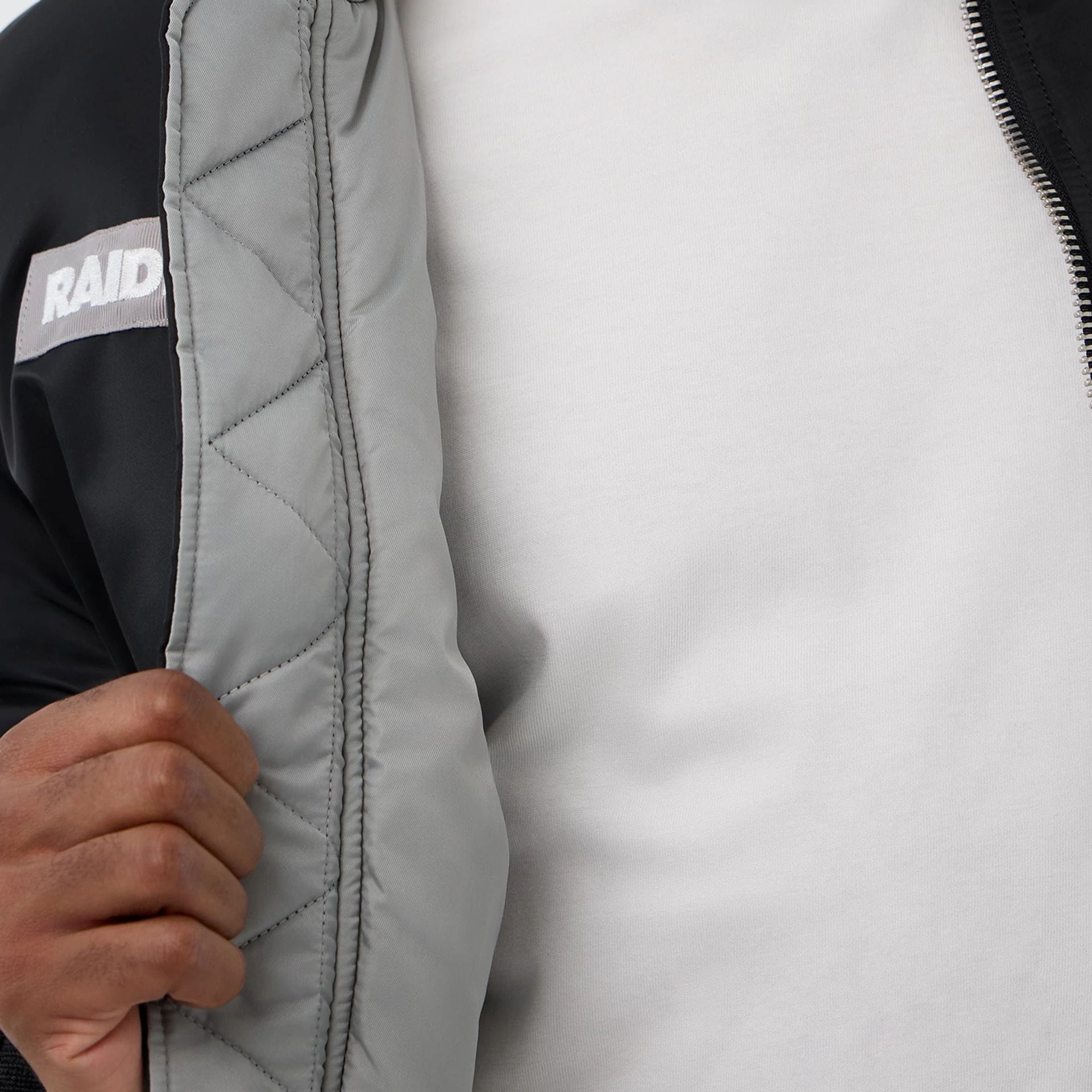 The Male model is wearing Las Vegas Raiders NFL x Alpha Black Jacket 3